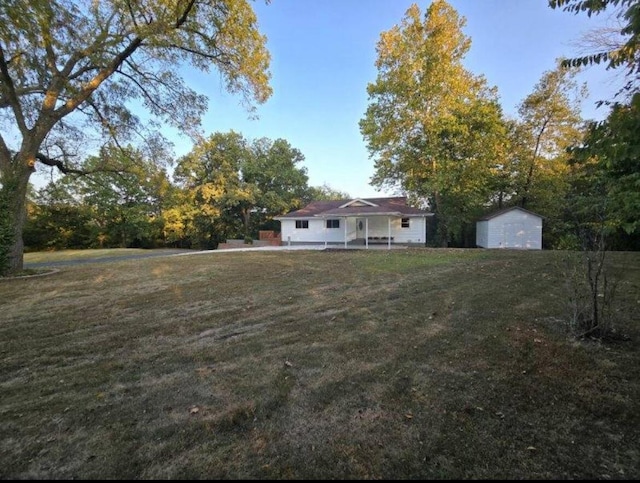 view of yard with a storage shed and an outdoor structure