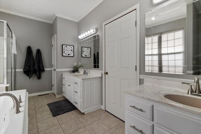 bathroom featuring tile patterned flooring, ornamental molding, and a sink