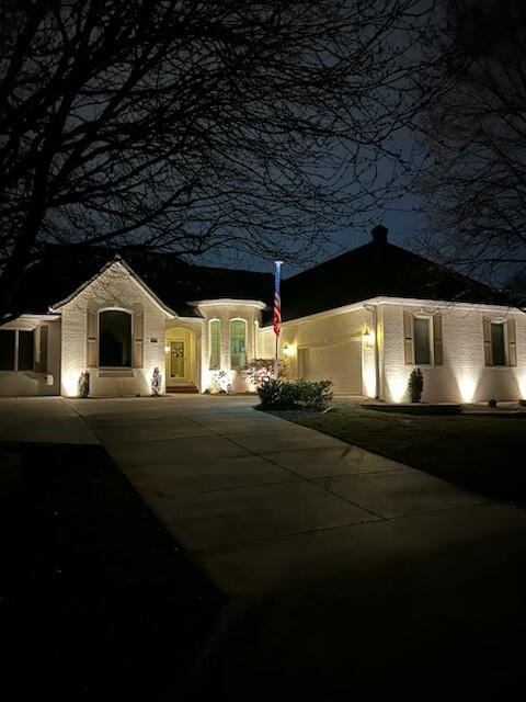 view of front of house featuring concrete driveway