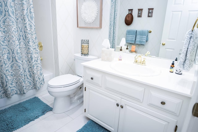 full bathroom with tile patterned floors, shower / tub combo with curtain, toilet, and vanity