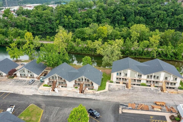 bird's eye view with a residential view and a water view