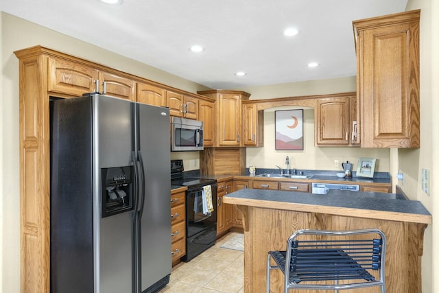 kitchen featuring stainless steel microwave, black range with electric cooktop, fridge with ice dispenser, a peninsula, and a sink