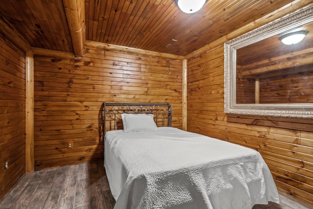 bedroom featuring wooden walls, wooden ceiling, and wood finished floors