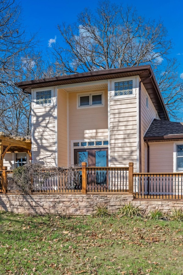 back of house featuring covered porch