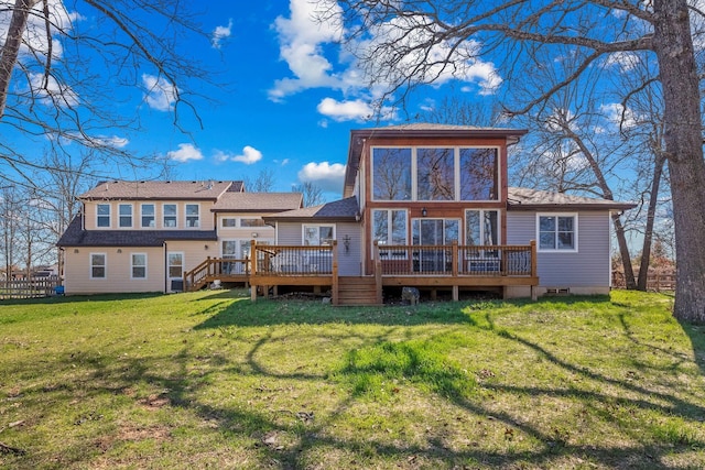 back of house with a yard, a wooden deck, and fence