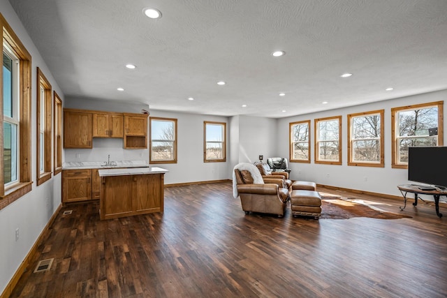 living room featuring recessed lighting, visible vents, baseboards, and dark wood-style flooring