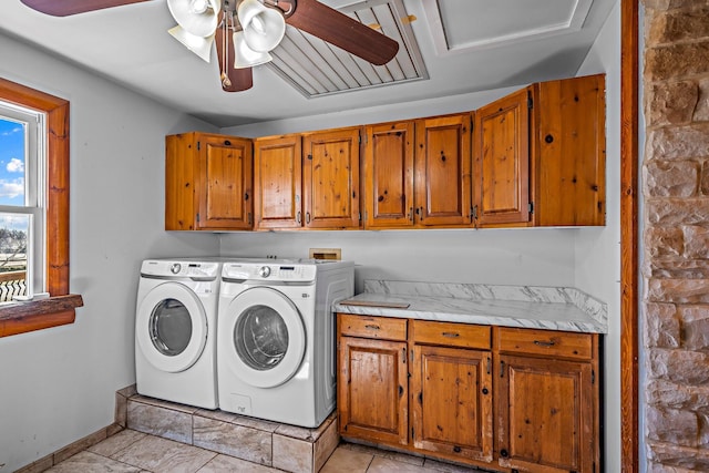 laundry area featuring a ceiling fan, cabinet space, baseboards, and washing machine and clothes dryer