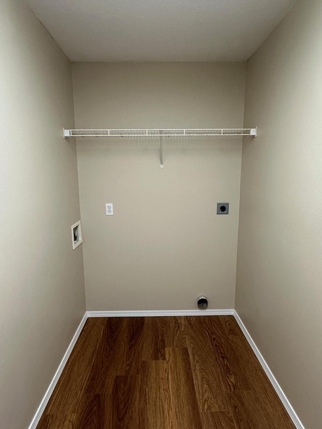 laundry room with baseboards, dark wood finished floors, laundry area, hookup for a washing machine, and electric dryer hookup