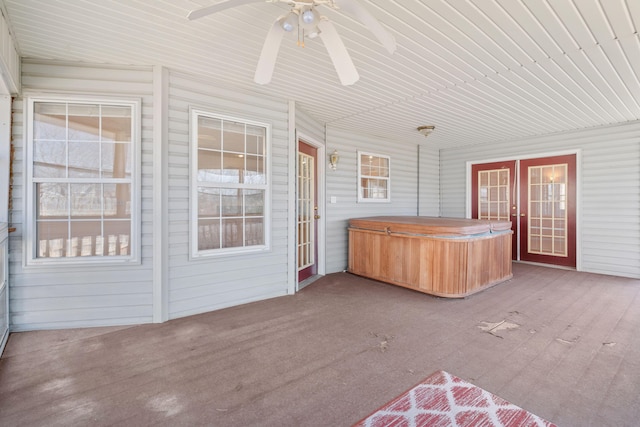 unfurnished sunroom with french doors and ceiling fan