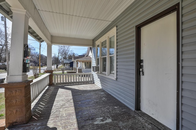 wooden terrace with a porch