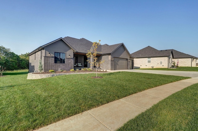 view of front of home featuring concrete driveway, a garage, brick siding, and a front yard