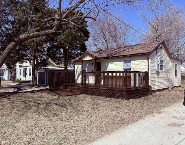 view of front facade with a wooden deck