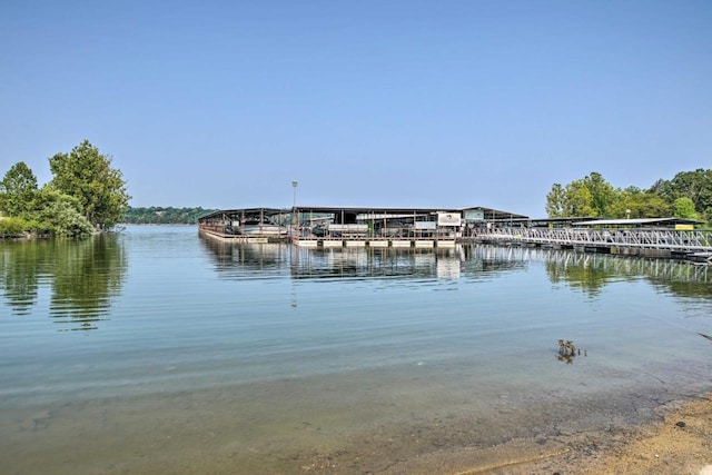 property view of water with a dock