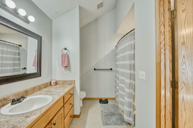 full bath featuring tile patterned floors, visible vents, toilet, baseboards, and vanity