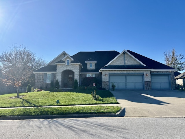 view of front of home featuring a front lawn, concrete driveway, brick siding, and a garage