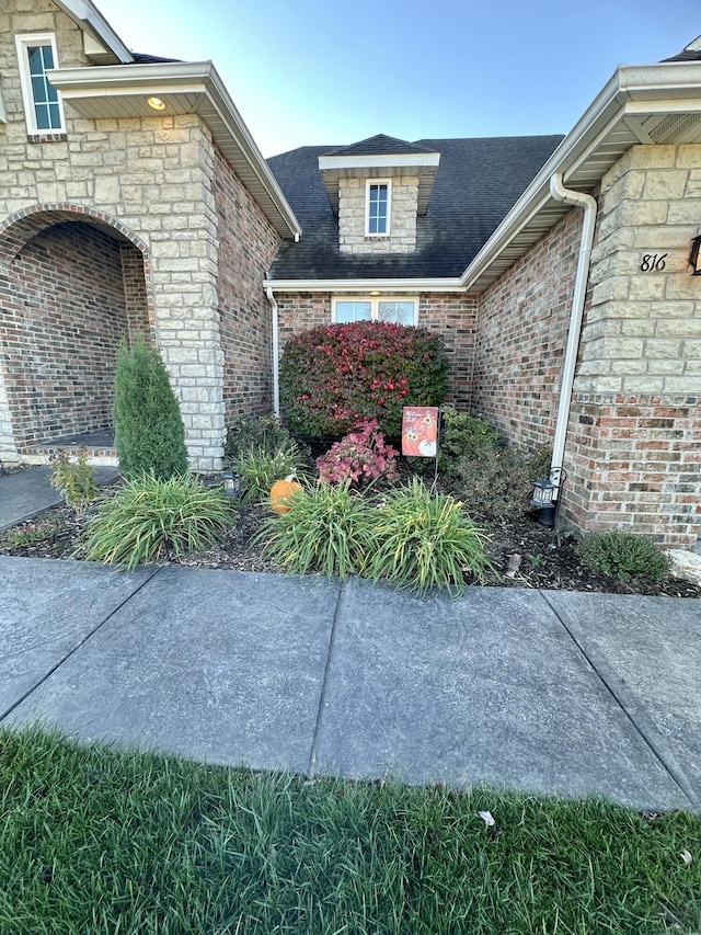 entrance to property with brick siding