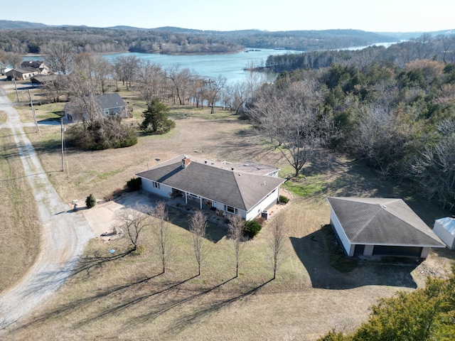 aerial view featuring a water view and a wooded view