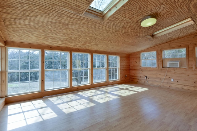 unfurnished sunroom with wooden ceiling, cooling unit, and lofted ceiling with skylight