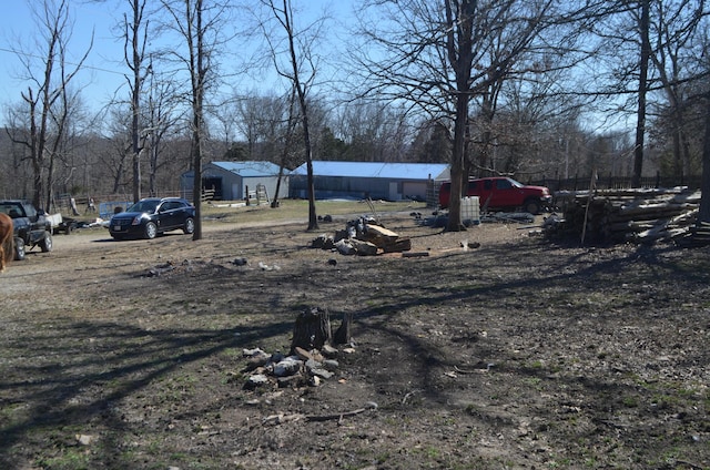 view of yard with an outbuilding and a pole building