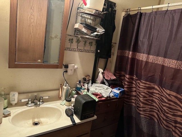 bathroom featuring vanity and a shower with curtain