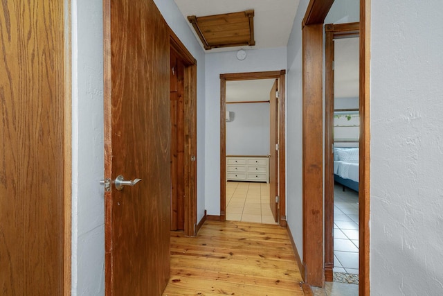 corridor featuring light wood-style floors