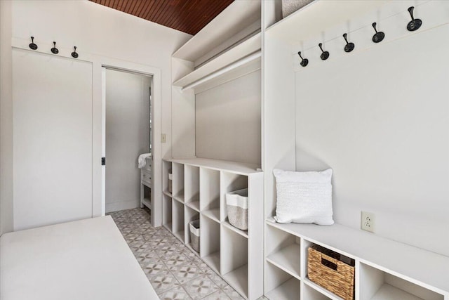 mudroom with tile patterned floors