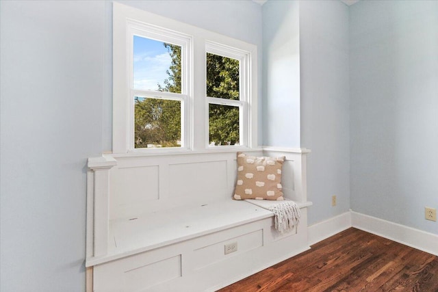 unfurnished room featuring dark wood finished floors and baseboards