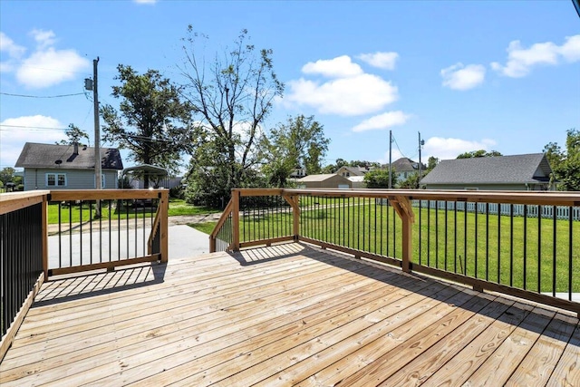 wooden terrace featuring a yard