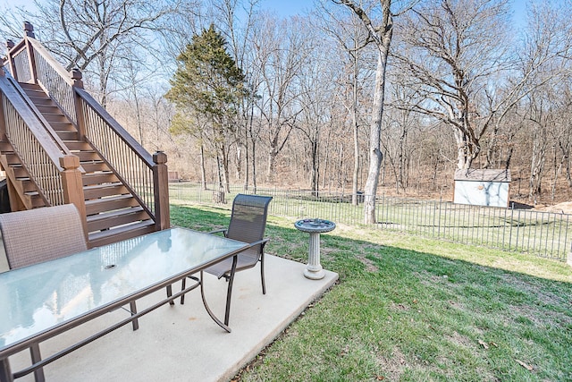 view of yard featuring stairway, a patio area, and fence