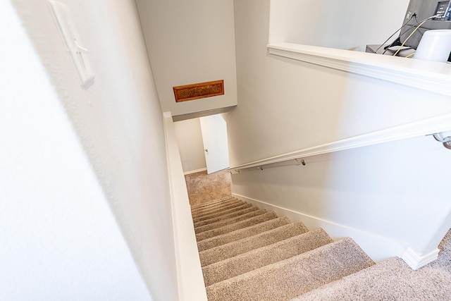 stairs with carpet and baseboards