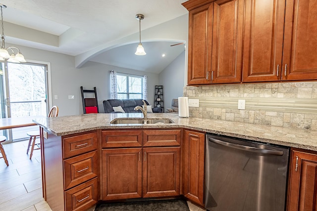 kitchen featuring a sink, light stone counters, a peninsula, decorative backsplash, and dishwasher