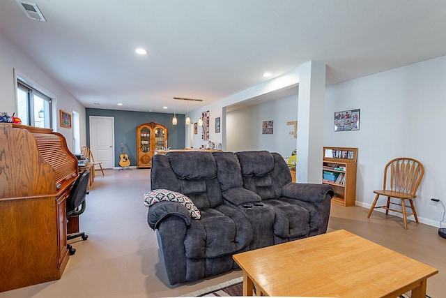 living area featuring recessed lighting, visible vents, and baseboards