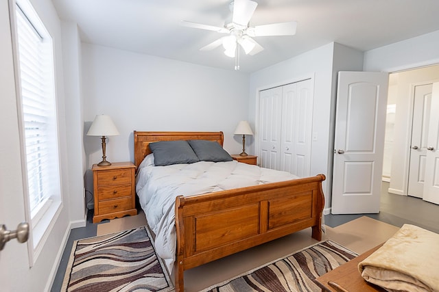 bedroom featuring a closet, baseboards, and a ceiling fan