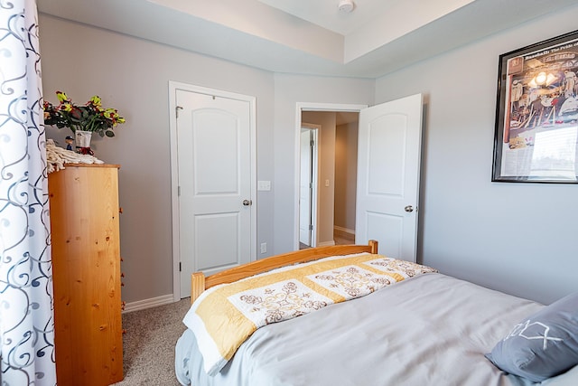 carpeted bedroom with baseboards