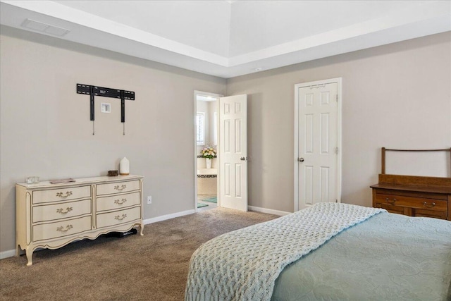 bedroom with visible vents, baseboards, connected bathroom, and carpet flooring