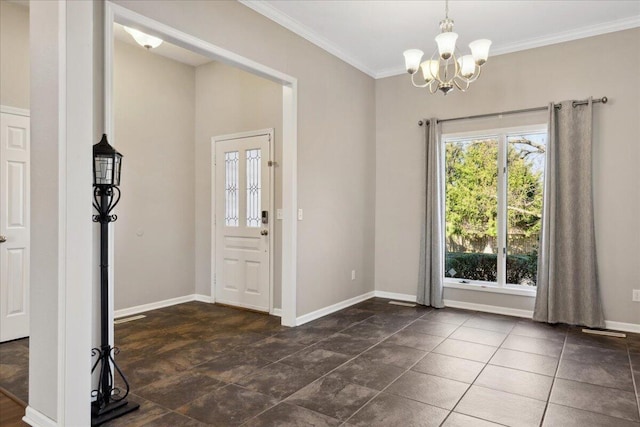 interior space with an inviting chandelier, baseboards, and ornamental molding