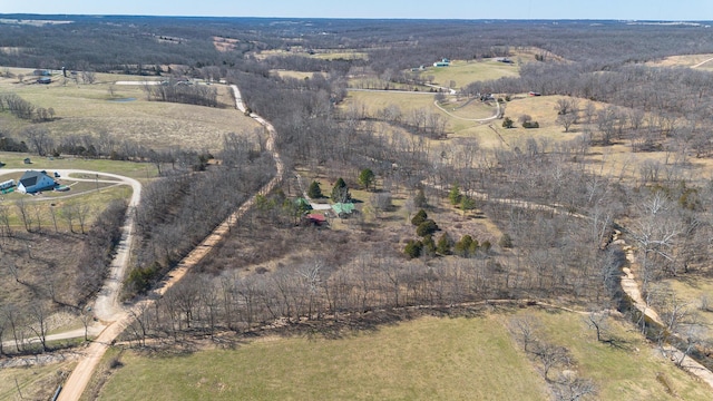 birds eye view of property featuring a rural view