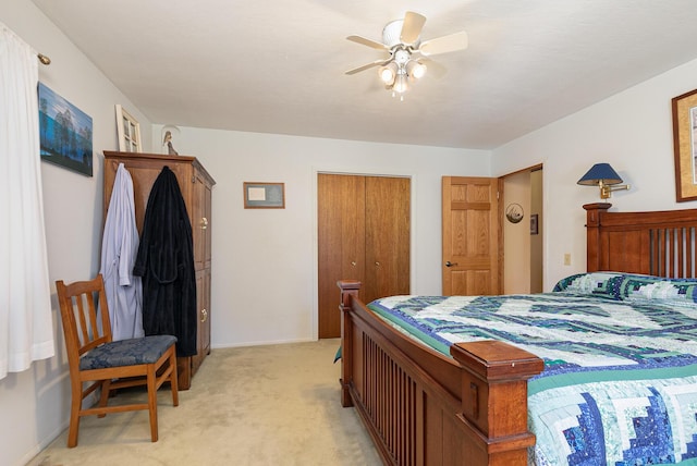 bedroom featuring ceiling fan and light carpet