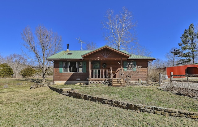 view of front facade featuring a front lawn, crawl space, covered porch, and metal roof