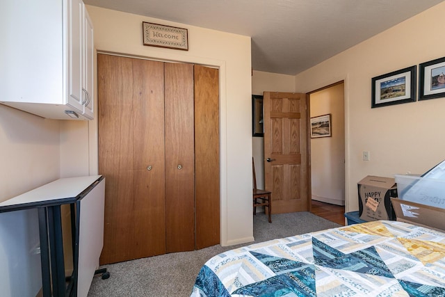 carpeted bedroom featuring a closet