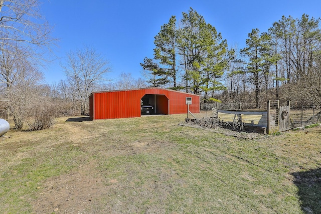 view of yard featuring an outbuilding and fence