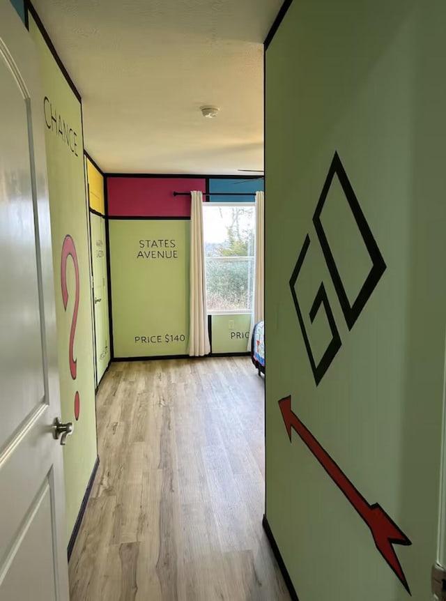 hallway with wood finished floors