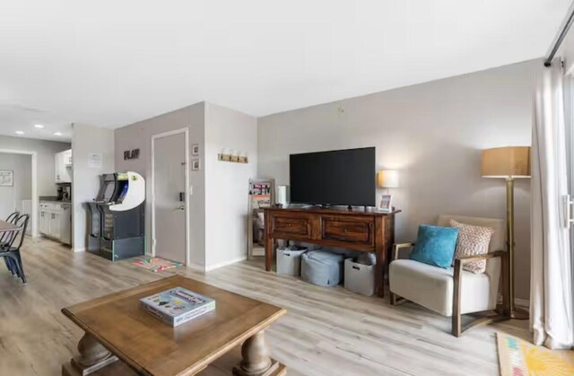 living area with light wood-style floors