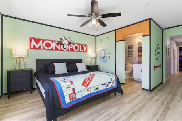 bedroom with ensuite bath, light wood-type flooring, ceiling fan, and ornamental molding