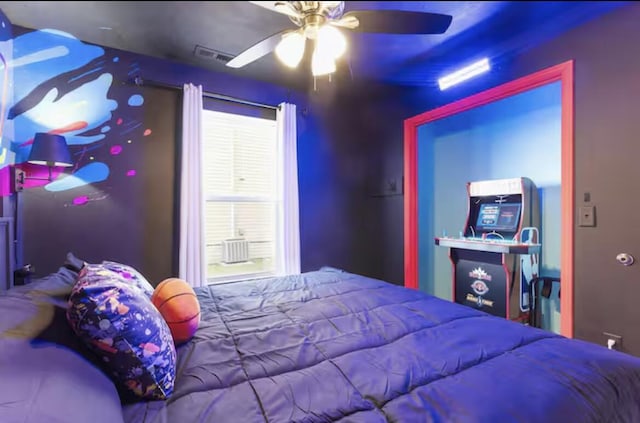 bedroom with a ceiling fan and visible vents