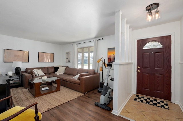 entrance foyer featuring baseboards and light wood finished floors