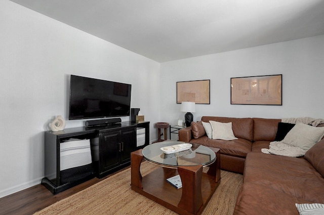 living room featuring wood finished floors and baseboards