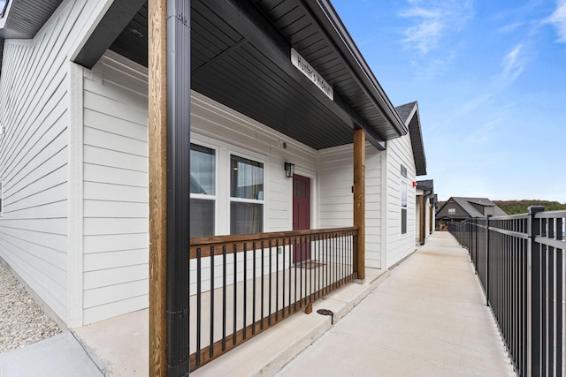 view of side of property featuring a porch