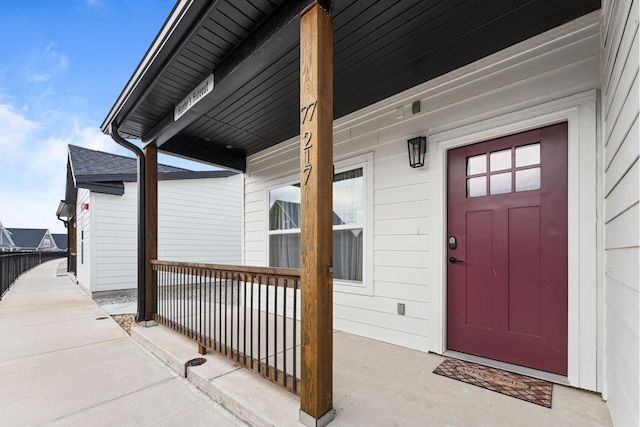 doorway to property featuring a porch