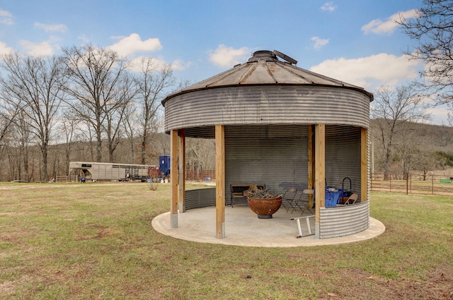 view of outbuilding with a gazebo and fence